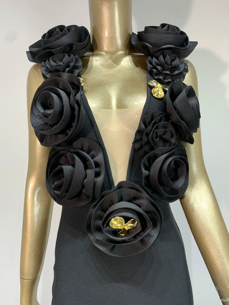 Black floral scarf with gold accents on a mannequin against a white background