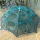 Green fishing net on a sandy surface with water in the background