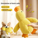 Dog sleeping with a dog hug duck toys to relieve boredom of little yellow duck p