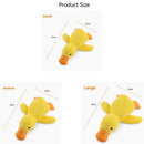 Dog sleeping with a dog hug duck toys to relieve boredom of little yellow duck p
