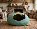 Handcrafted Wool Felt Cat Cave Bed in rustic farmhouse with black cat