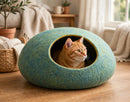 Handcrafted Wool Felt Cat Cave Bed in cozy living room with orange tabby cat