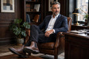 Men's Waterproof Leather Chelsea Boots - brown boots on model, executive office