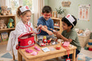 Pretend Doctor Play Kit - group of kids playing doctor together in playroom clinic
