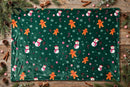 Cozy Gingerbread Fleece Throw Blanket - flat lay with pine and cinnamon sticks